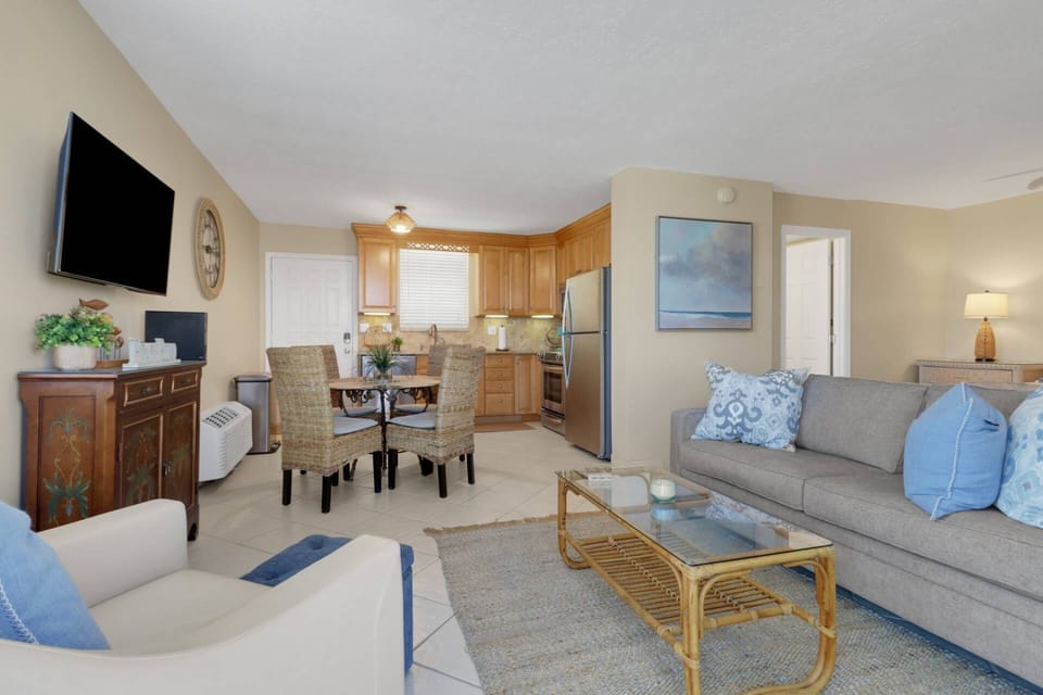 The living space flows easily into the dining area and kitchen.