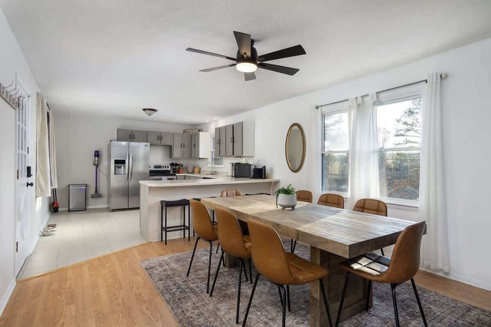 Dining table for 8 and 3 additional barstools in the kitchen