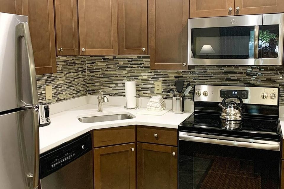 Full kitchen with oven and full stove available in some condos, while others have a well-equipped partial kitchen. Requests can be made but are not guaranteed.