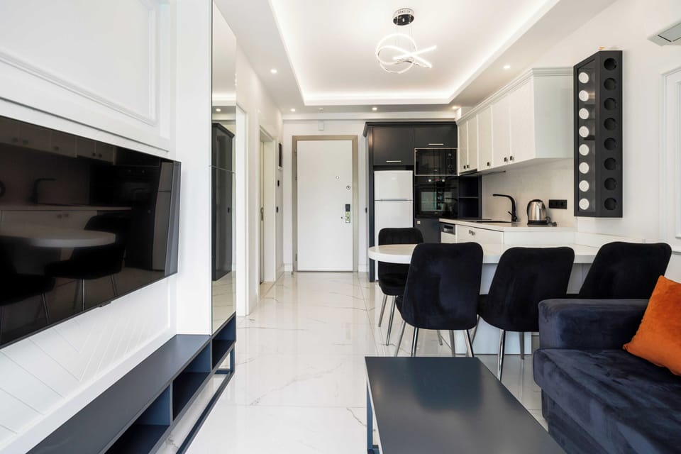 Basic Room | Living area | 55-inch flat-screen TV with cable channels, TV, heated floors
