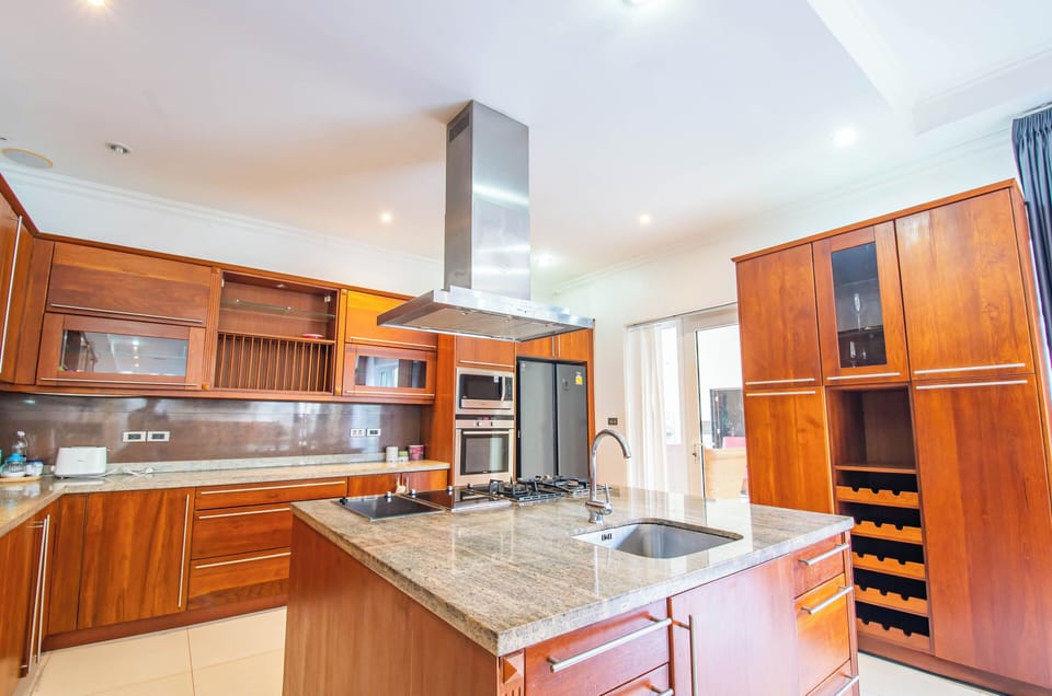 Luxury Villa | Private kitchen | Full-size fridge, microwave, oven, stovetop