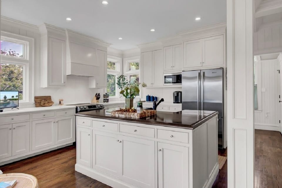 - Entertain in style with this magazine worthy kitchen and oversized prep island - Stainless steel appliances and custom cabinets make cooking feel effortless - From pancake mornings to wine nights, this kitchen’s the heart of the home