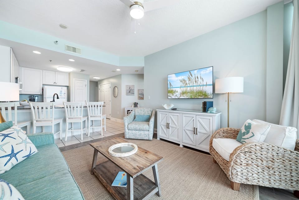 Light and airy living space featuring coastal-inspired decor and a seamless flow between the living and dining areas.