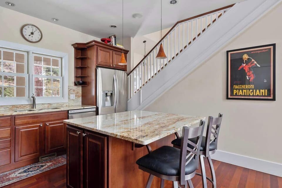 Want a snack or cup of morning coffee? Gather round the kitchen island, y'all!