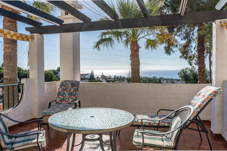 Large patio with sea and golf course views.