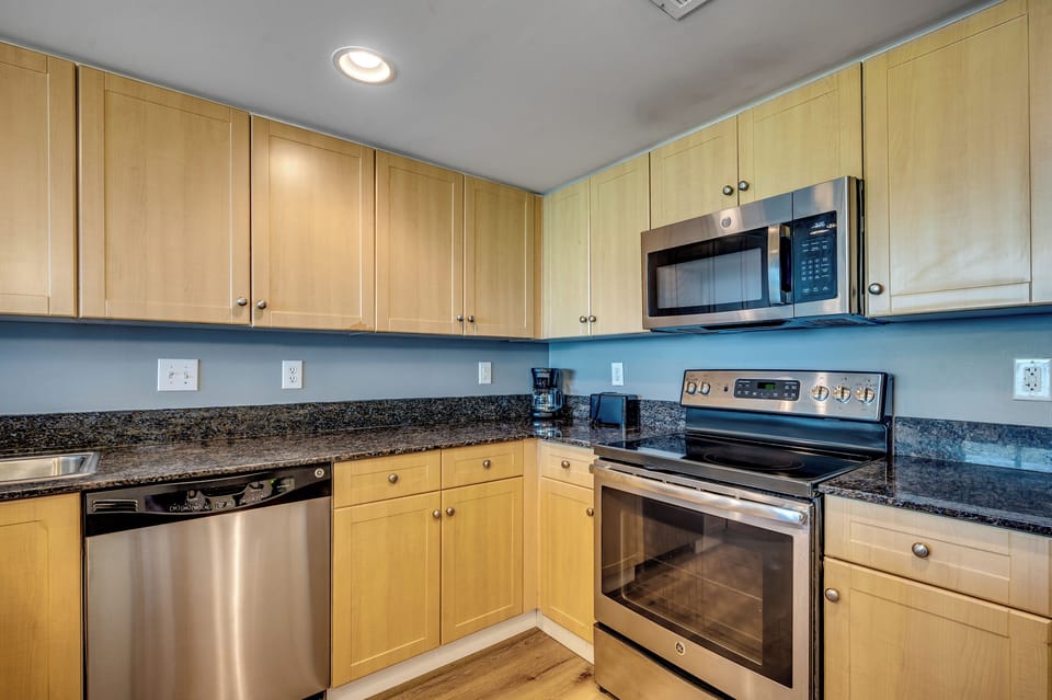 Full kitchen with stainless steel appliances