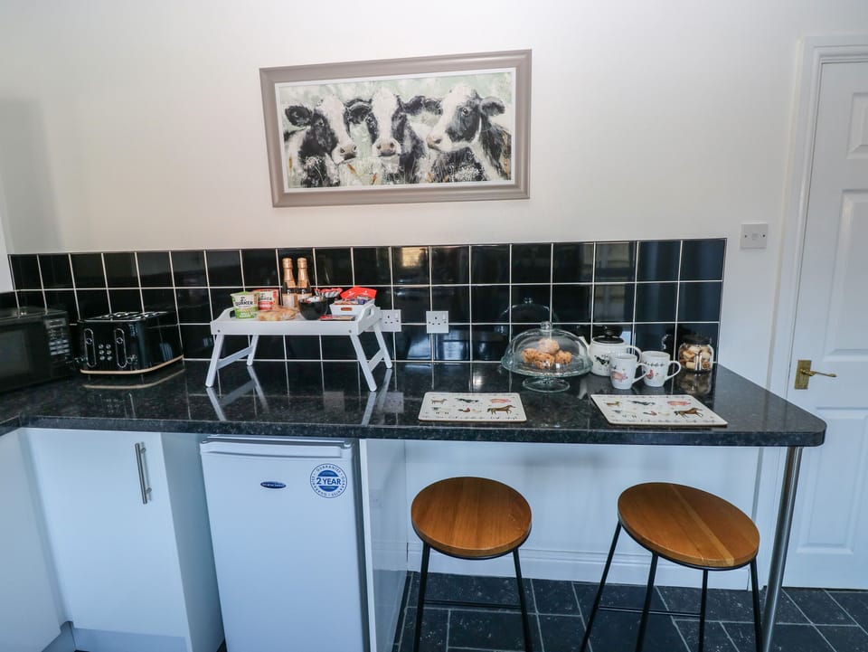Fridge, electric kettle, toaster, cookware/dishes/utensils
