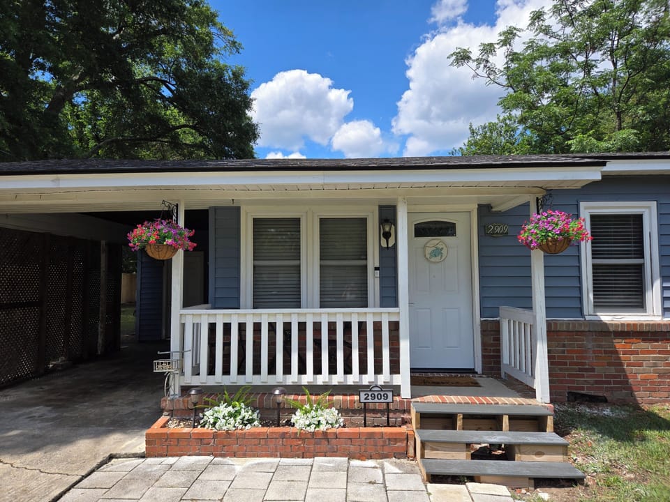 Small covered patio in the front of the home.