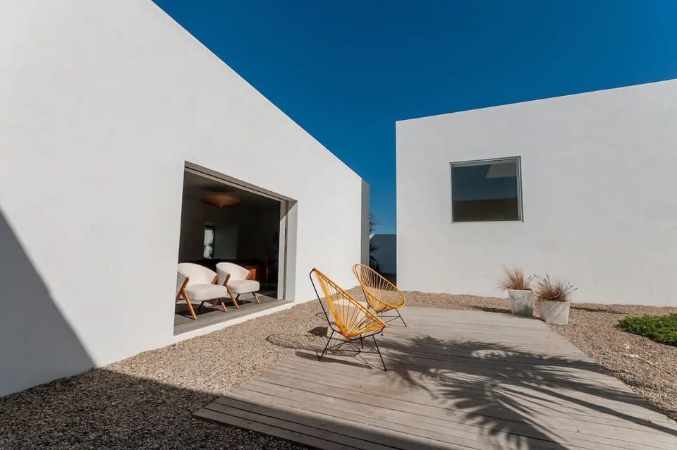 Light streams into the living & dining room (left) and studio (right).