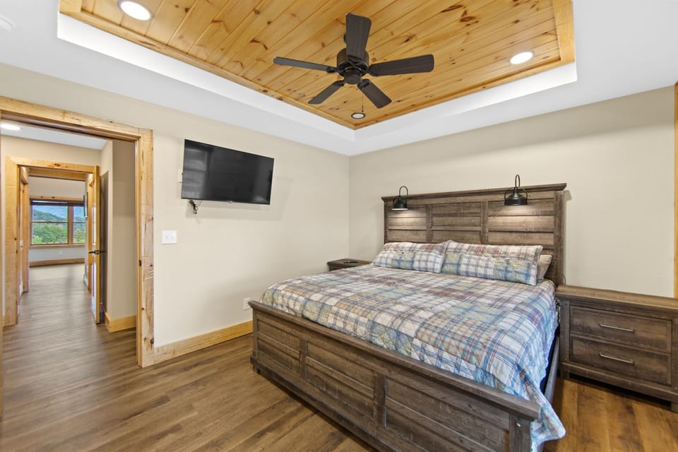 Indulge in luxury in this exquisite second master suite. Features include a spacious king-size bed, ample storage with a dresser, and a private ensuite bathroom. Escape to your dream vacation oasis.