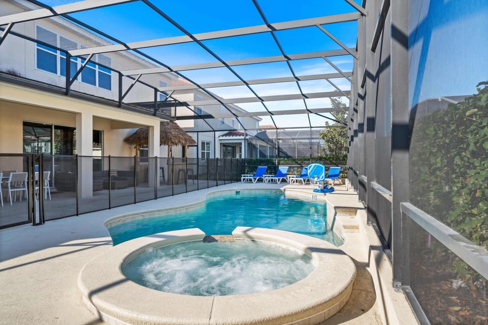 - Screened private pool with relaxing spa and lounge chairs  
- Spacious patio seating perfect for sun and shade enjoyment  
- Orlando vacation rental with private pool near theme parks
