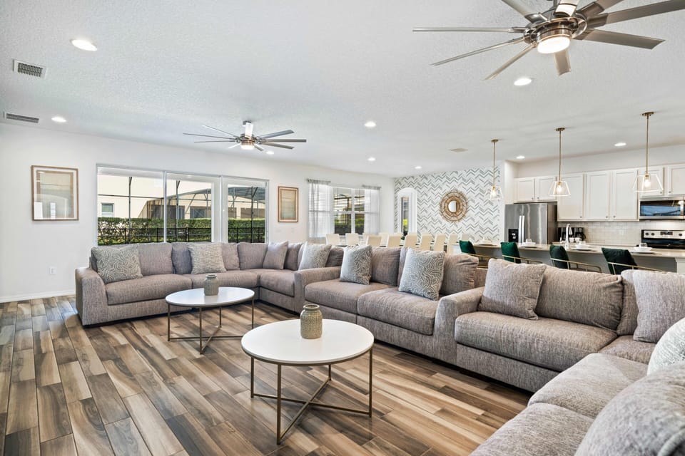 - Family-friendly vacation rental with oversized living area  
- Multiple couches, modern kitchen, and dining for big groups  
- Orlando rental near Disney designed for large family stays