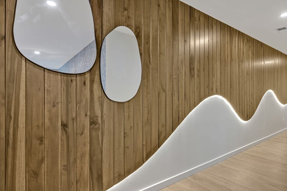 The entrance foyer leads to an open floor kitchen, living room, and dining area.