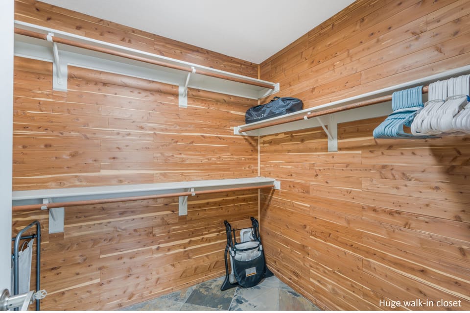 Walk-in closet in primary bedroom.