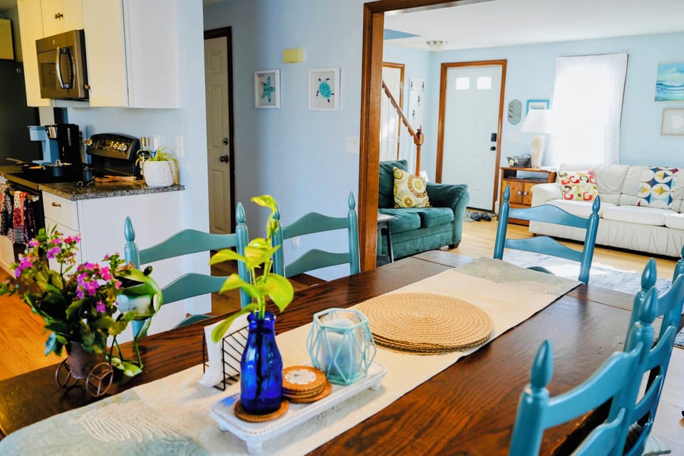 A bright dining area offers seating for six to eight people