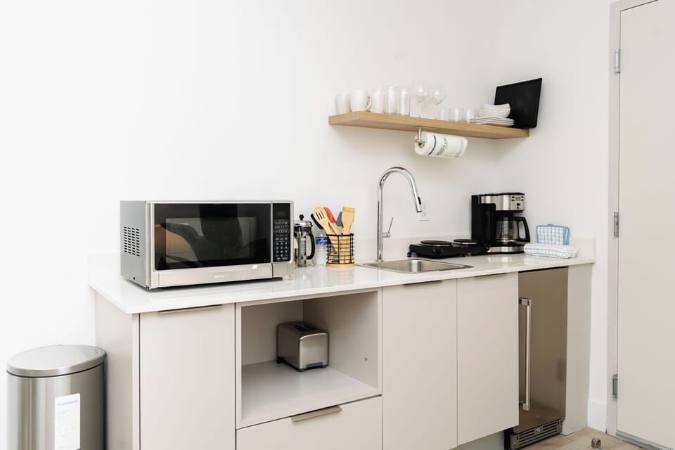 Kitchenette stocked with Coffee Maker and Microwave
