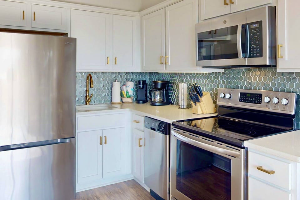 Updated kitchen with a coastal backsplash
