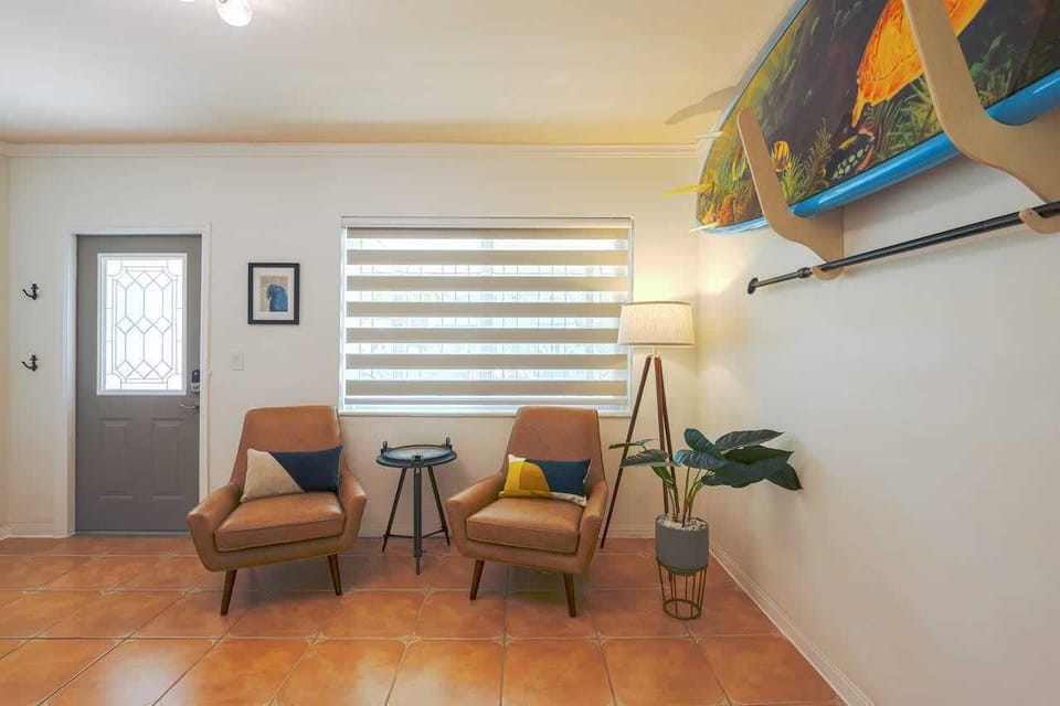 A charming sitting area, adorned with tasteful art and decor, providing the perfect retreat for peaceful solo moments or enjoying a good read.