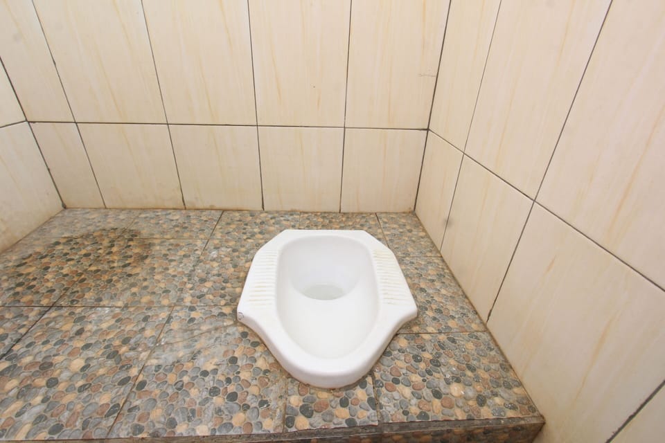 Economy Double Room | Bathroom | Shower, towels, soap