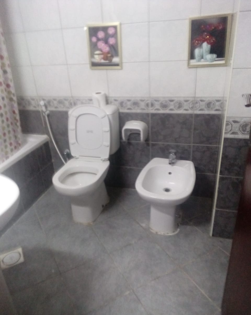 Combined shower/tub, slippers, towels, soap