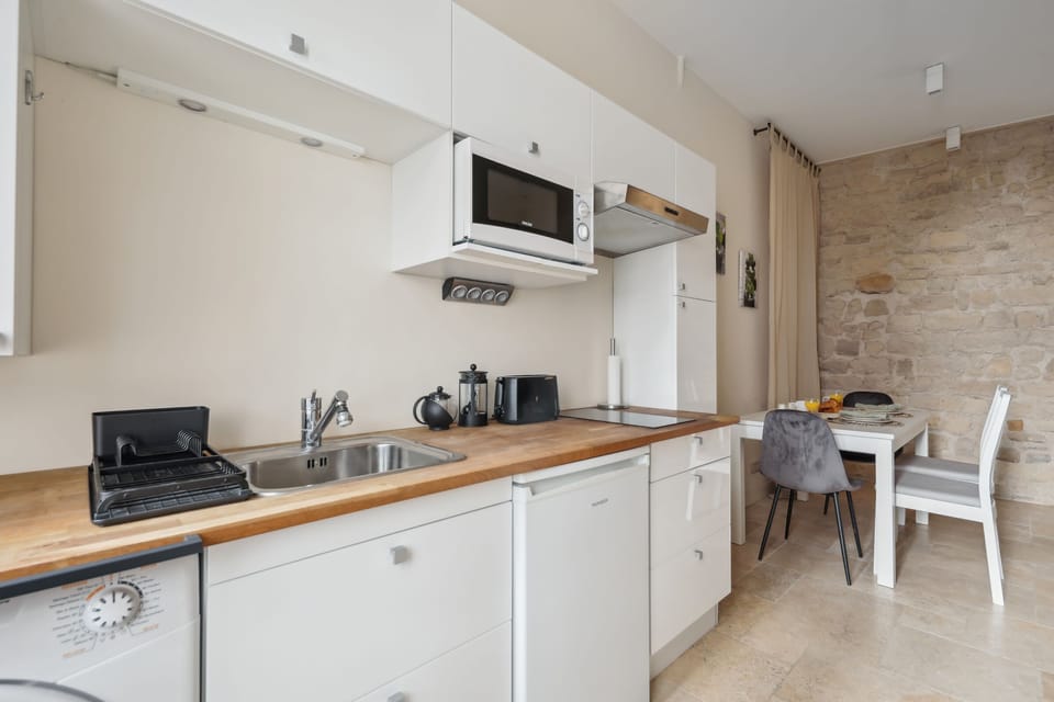 The kitchen is fully equipped to prepare a simple meal