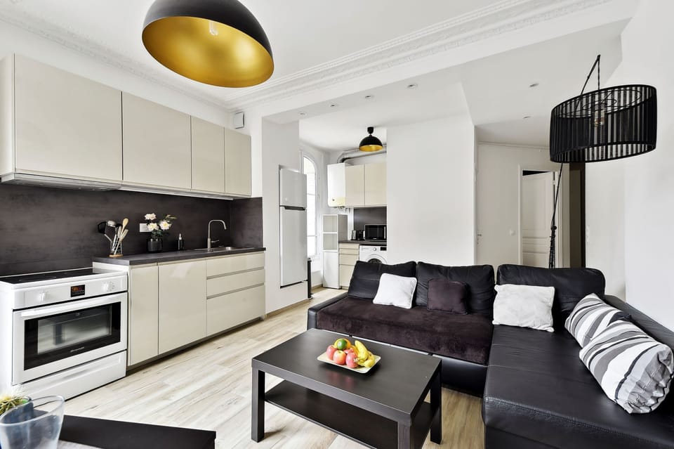 The open-plan living area and the kitchen