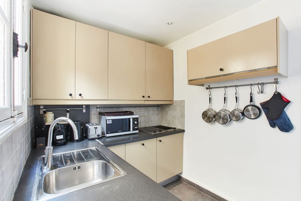 The kitchen is fully equipped to prepare a simple meal