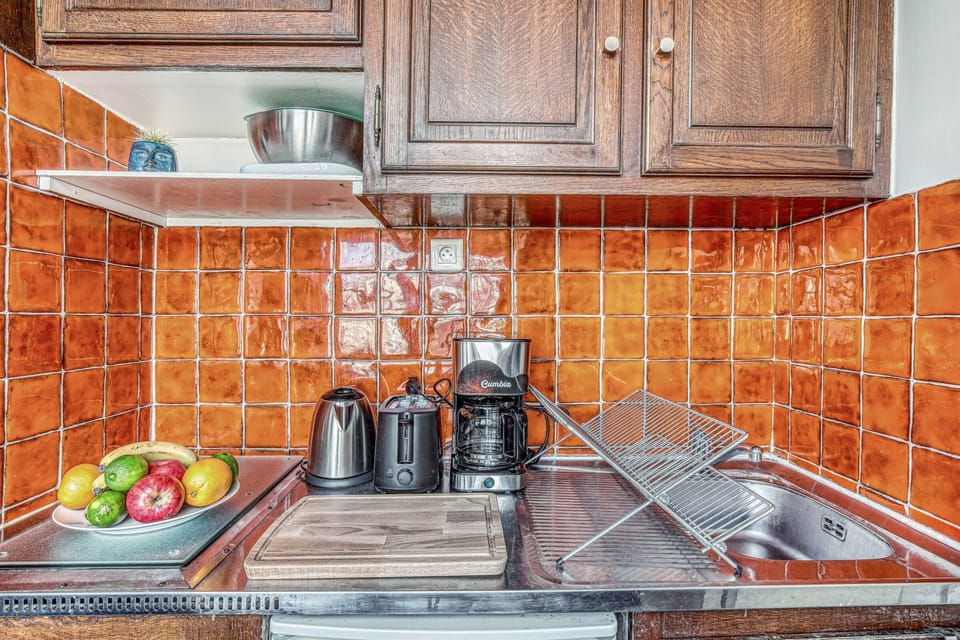 The kitchen is fully equipped to prepare a simple meal