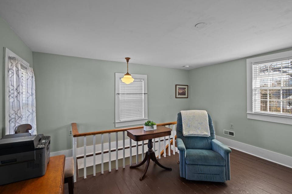 Upstairs sitting area features cozy recliner