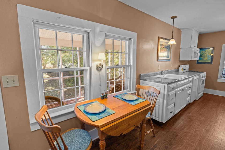 Small dining table seats two. Seating bar in kitchen seats two more.
