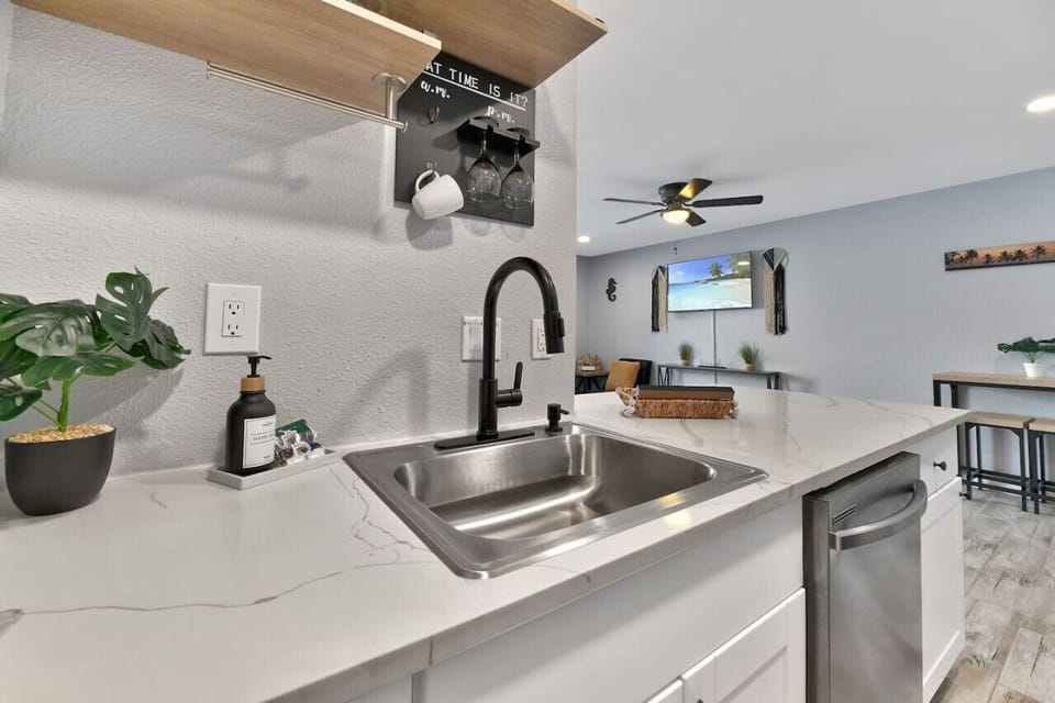 Stay Awhile vacation rental kitchen with appliances, cookware, and dining essentials