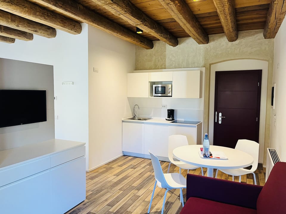 Studio | Living area | 27-inch LED TV with satellite channels