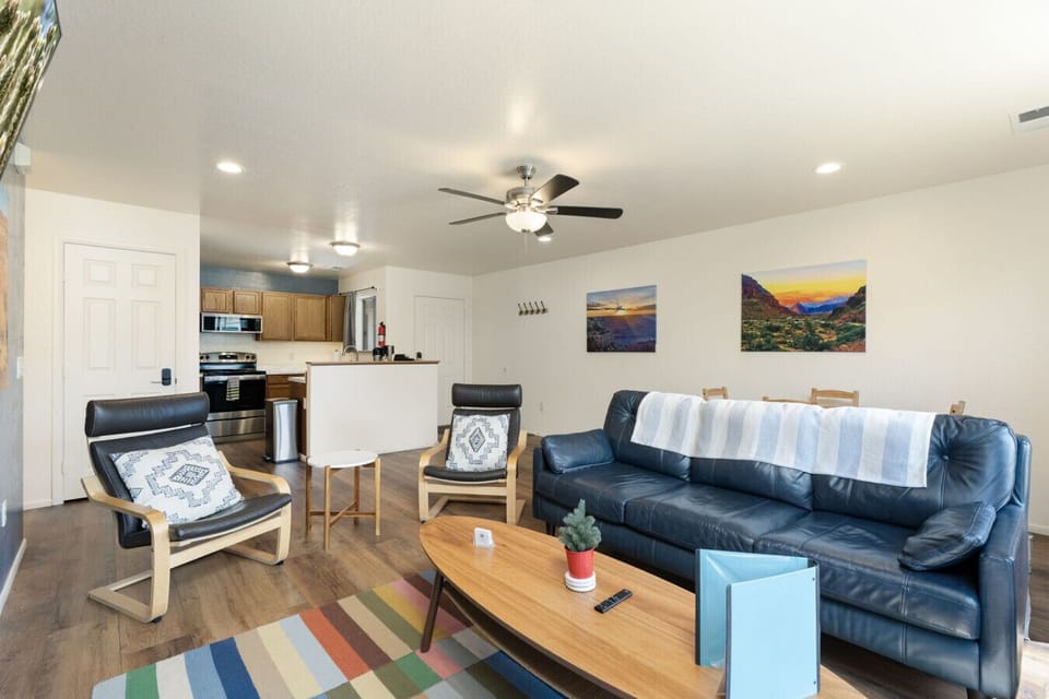 Spacious living room with colorful accents, comfortable seating, and room to spread out.