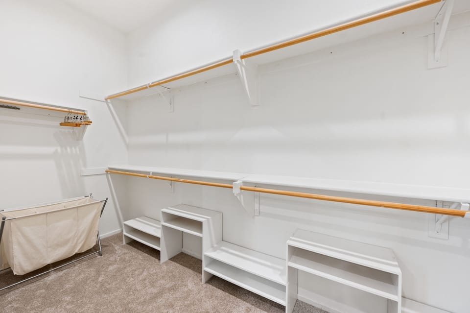 Spacious closet in primary bedroom.  Luggage racks provided.