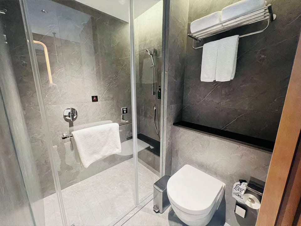 Eco-friendly toiletries, hair dryer, bathrobes, slippers