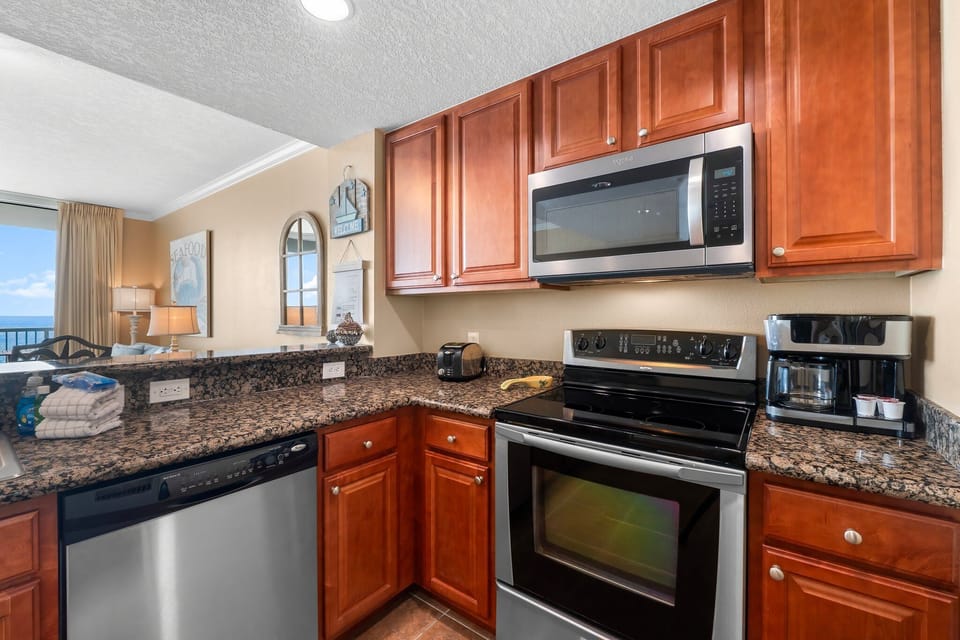 Fully Equipped Kitchen • Granite Counters • Stainless Appliances • Beachfront Stay
