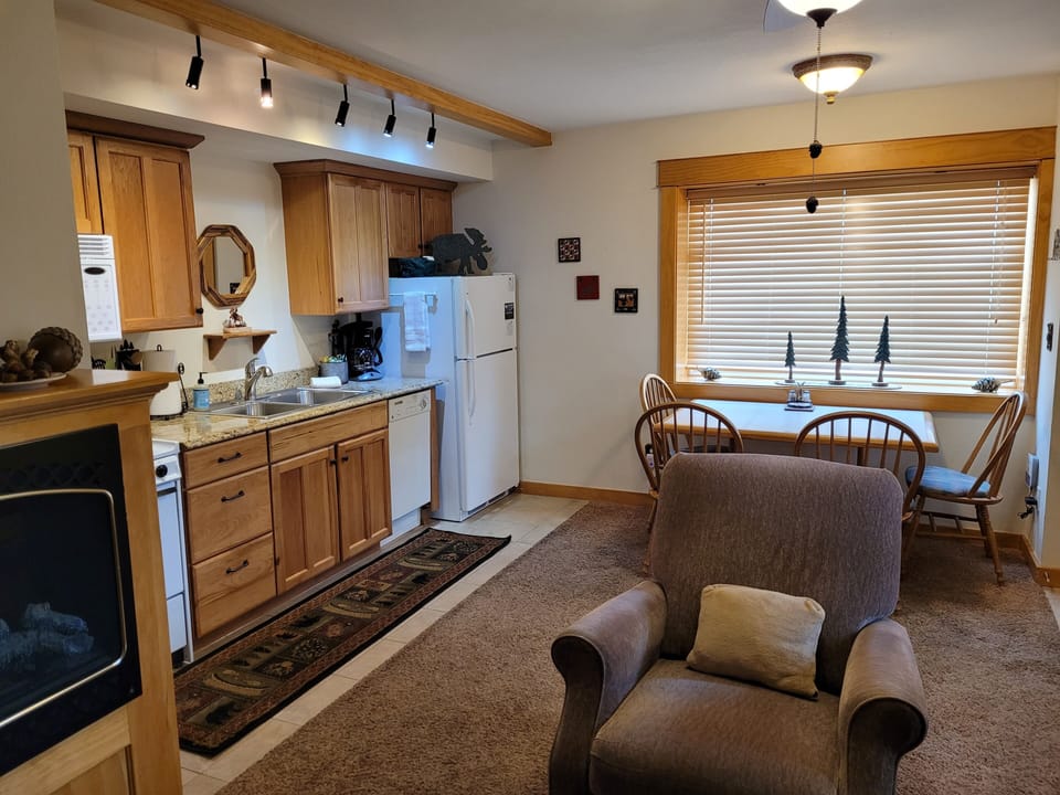 Living area open to kitchenette and dining area 