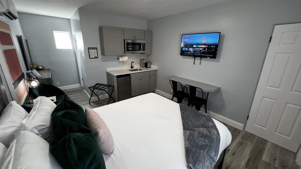 Kitchenette is equipped with mini fridge, microwave, toaster, coffee machine