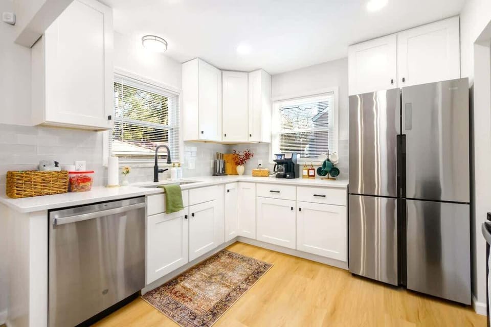 Modern kitchen w/ stainless appliances, ample cabinets & clean finishes