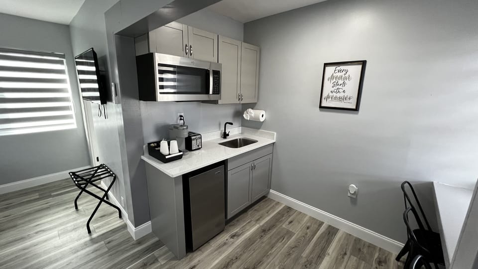 Kitchenette is equipped with mini fridge, microwave, toaster, coffee machine