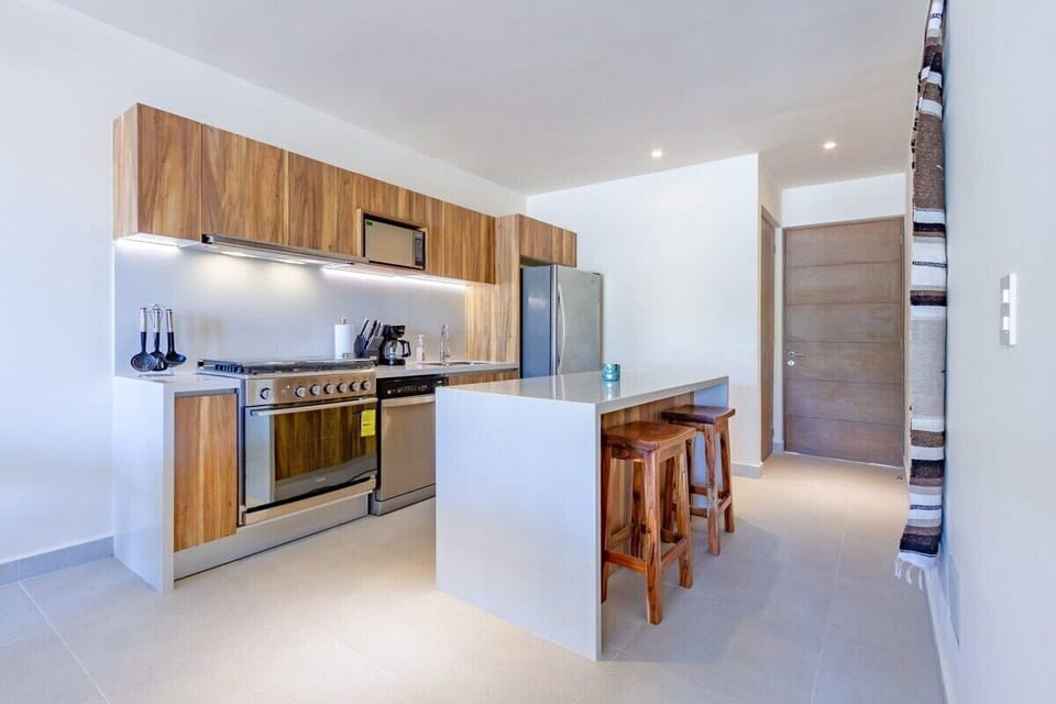 Premium appliances, six-burner stove, and island seating for easy meals.