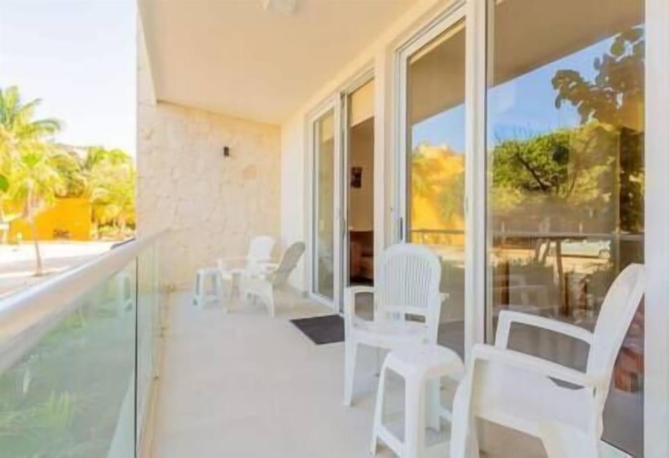Feel the Caribbean breeze on the balcony accessible from bedroom or living room. 