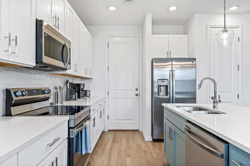 The kitchen features stainless steel appliances with all you need to prepare delicious meals.