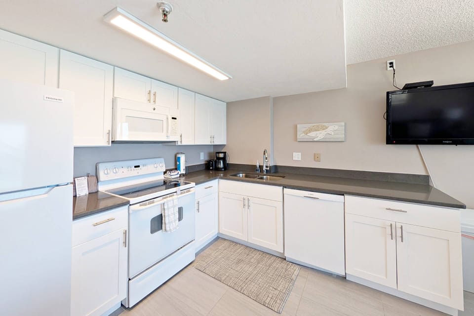 ...a kitchen with full size appliances to conveniently cook your own meals....