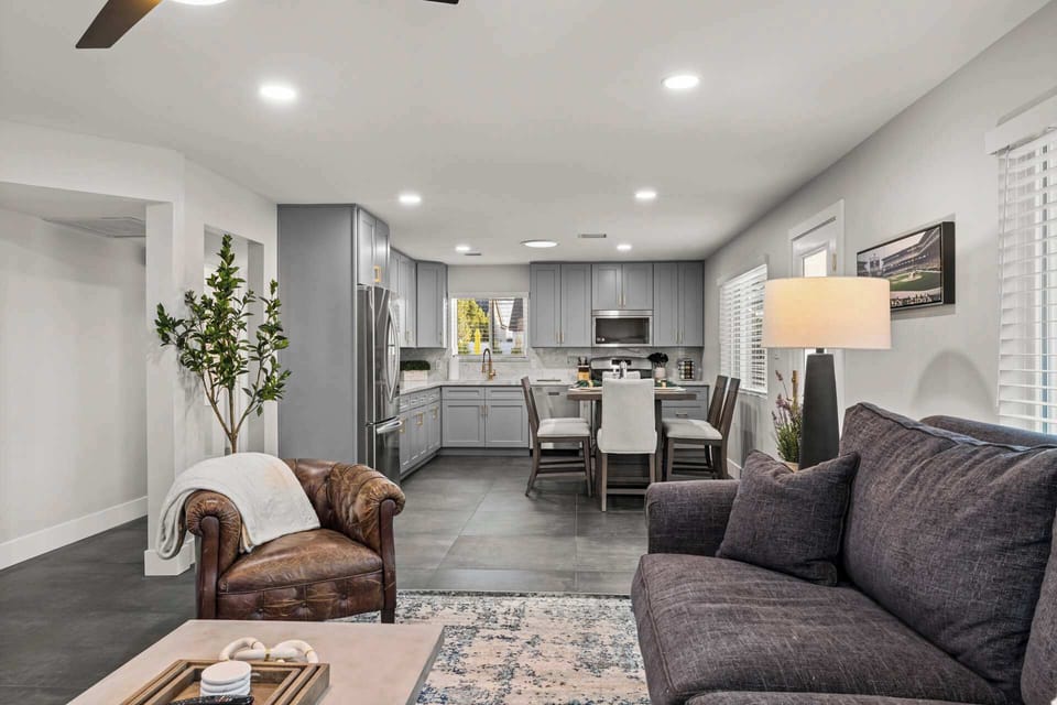 Casa Principal open plan living room with view to kitchen.