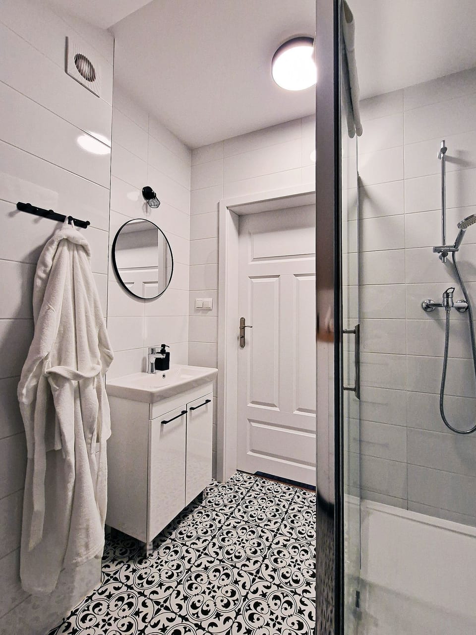 Comfort Condo | Bathroom | Hair dryer, towels, toilet paper