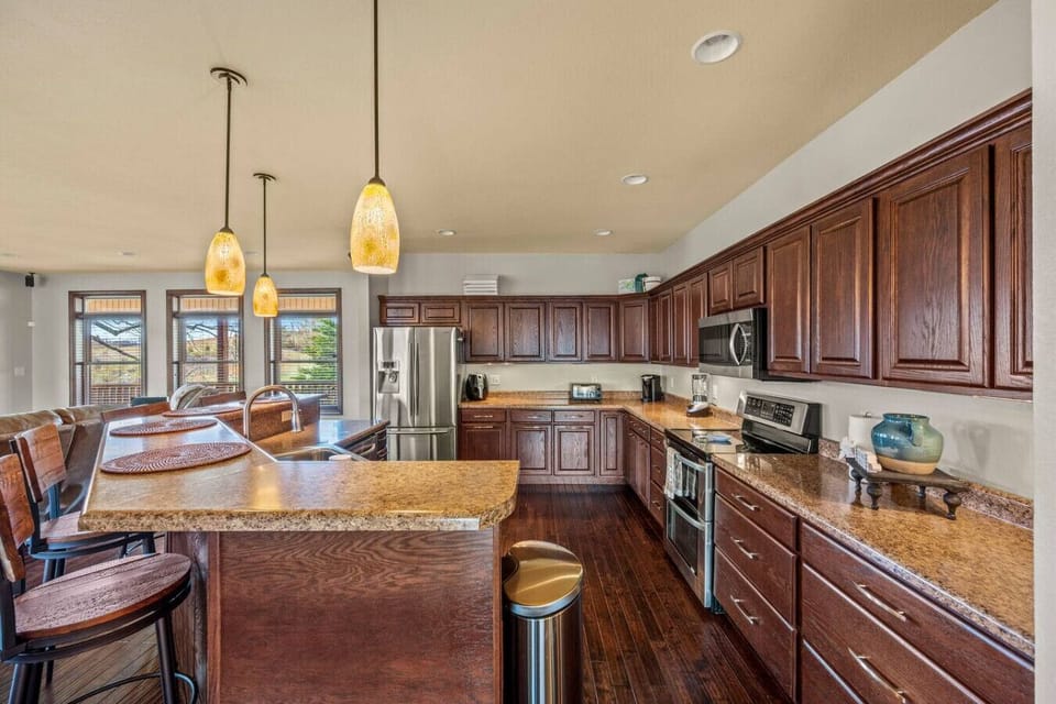 The fully equipped kitchen contains lots of storage space and is complete with appliances, pots/pans, dishware, cookware, silverware and more.