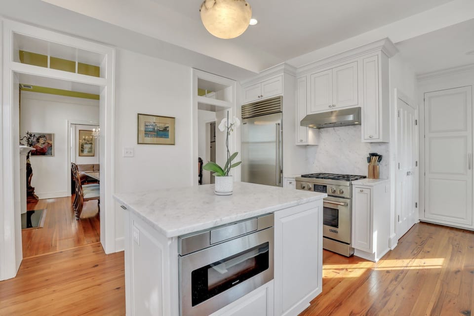 Marble countertops are carried throughout the kitchen, along with top-of-the-line stainless steel appliances.