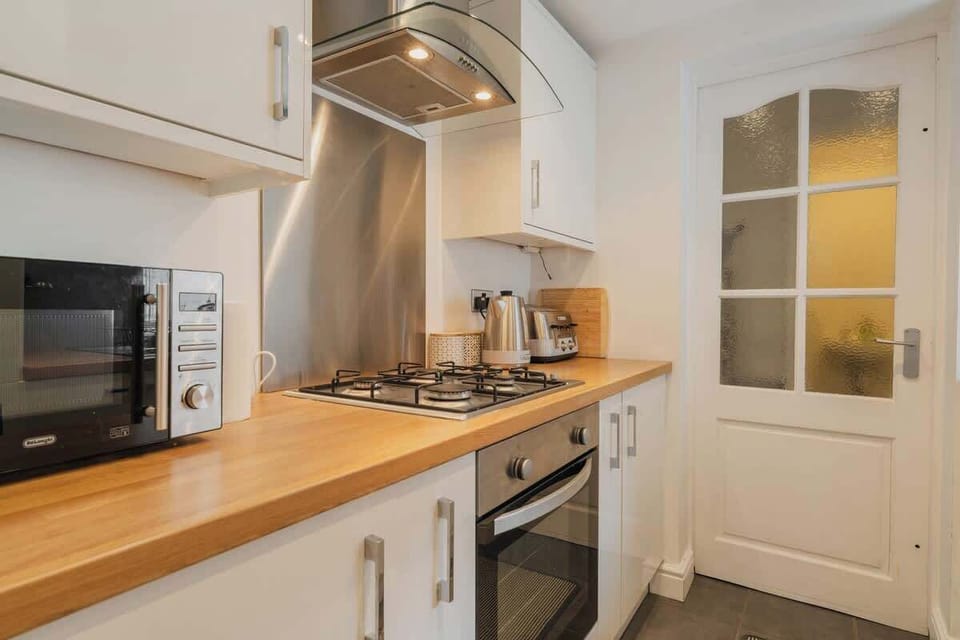 The Kitchen: Cook up a storm in the functional kitchen with modern amenities.