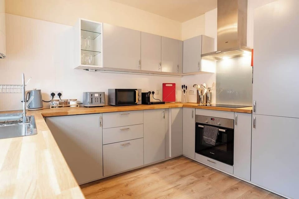 The Kitchen: the modern kitchen comes well equipped with everything you need for a comfortable stay.